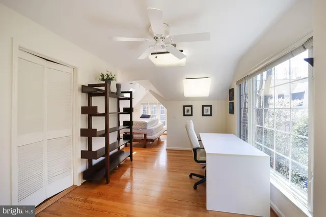 a view of a livingroom with furniture staircase and a kitchen