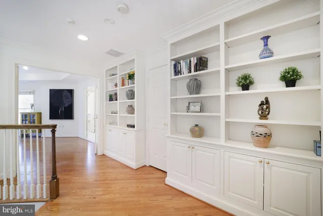 a view of workspace with wooden floor and cabinet