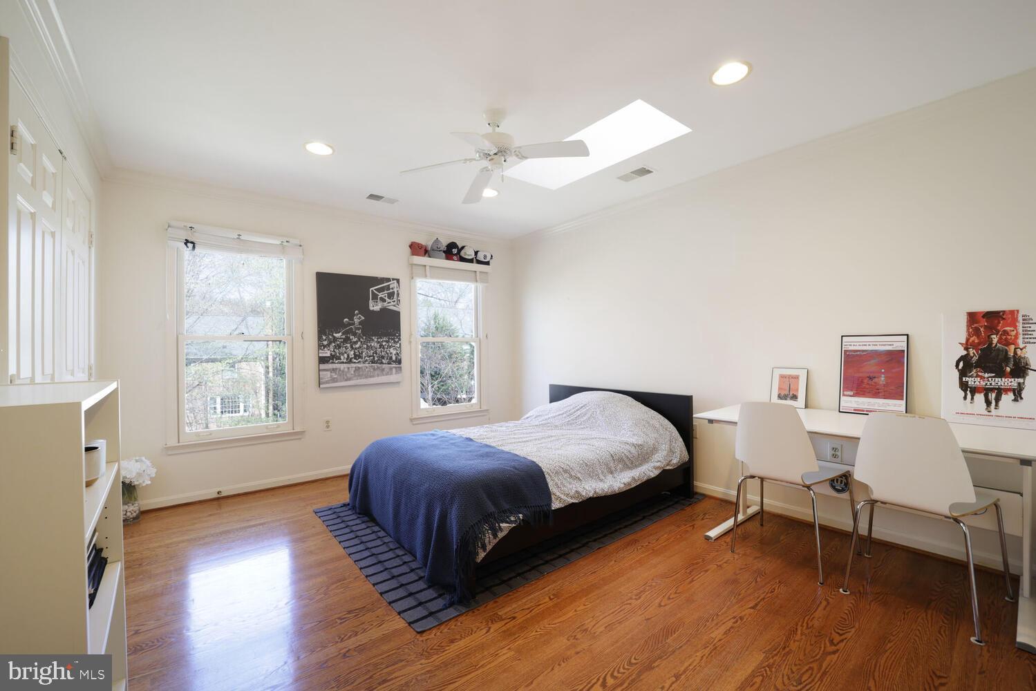 5119 Warren Place Northwest Washington, DC 20016 - Photo 26 of 37 a bedroom with a bed and a large window