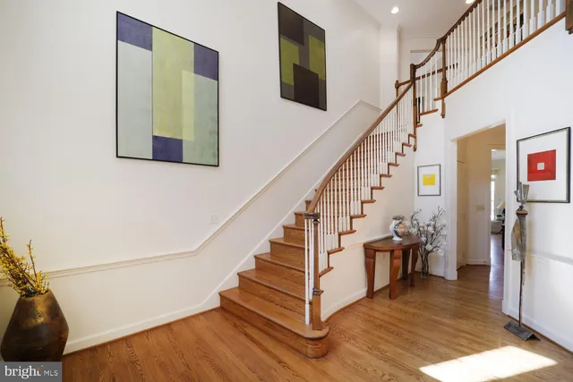 a view of entryway and hall with wooden floor