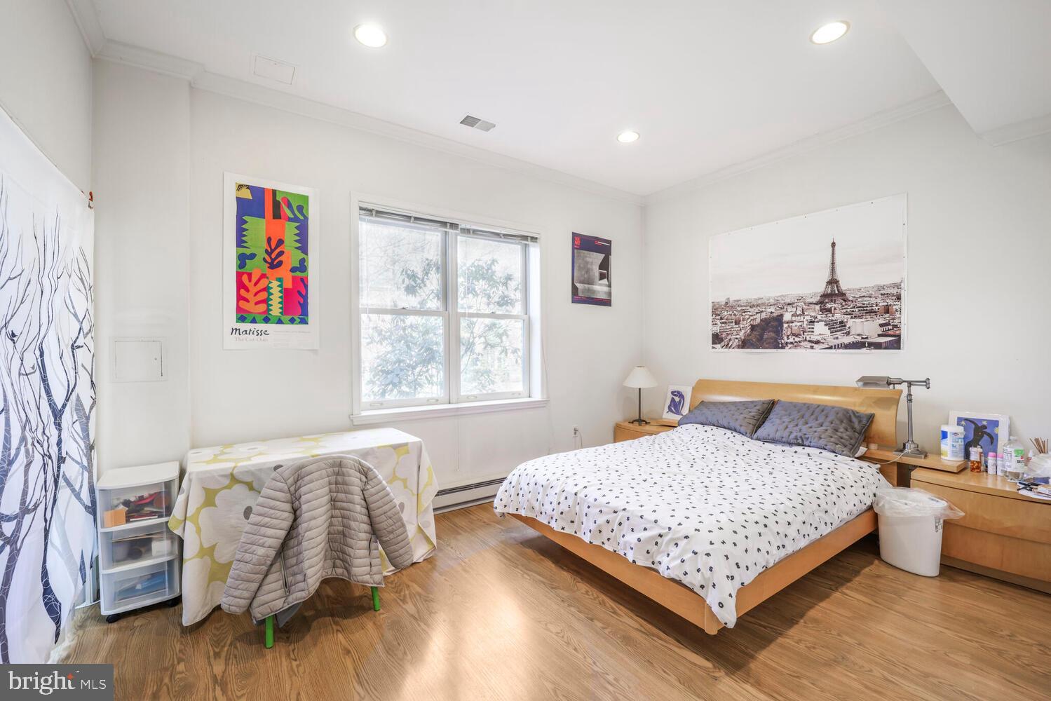 5119 Warren Place Northwest Washington, DC 20016 - Photo 32 of 37 a bedroom with a bed and a couch