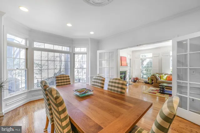 a living room with furniture and large windows