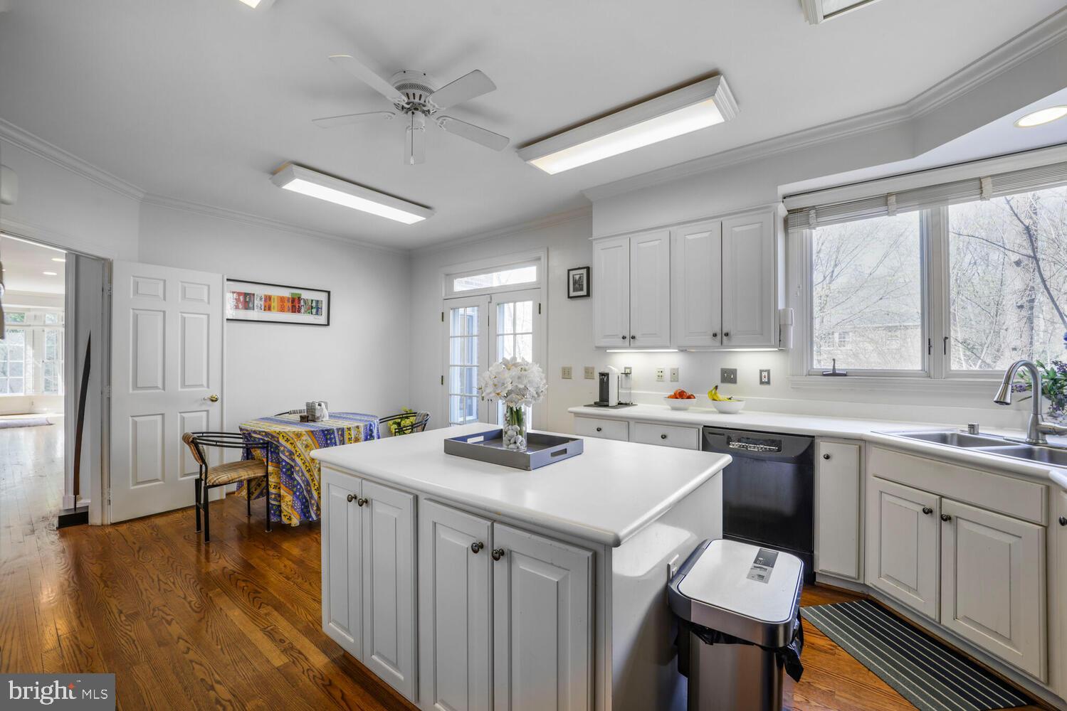 5119 Warren Place Northwest Washington, DC 20016 - Photo 8 of 37 a kitchen with a sink stove and cabinets