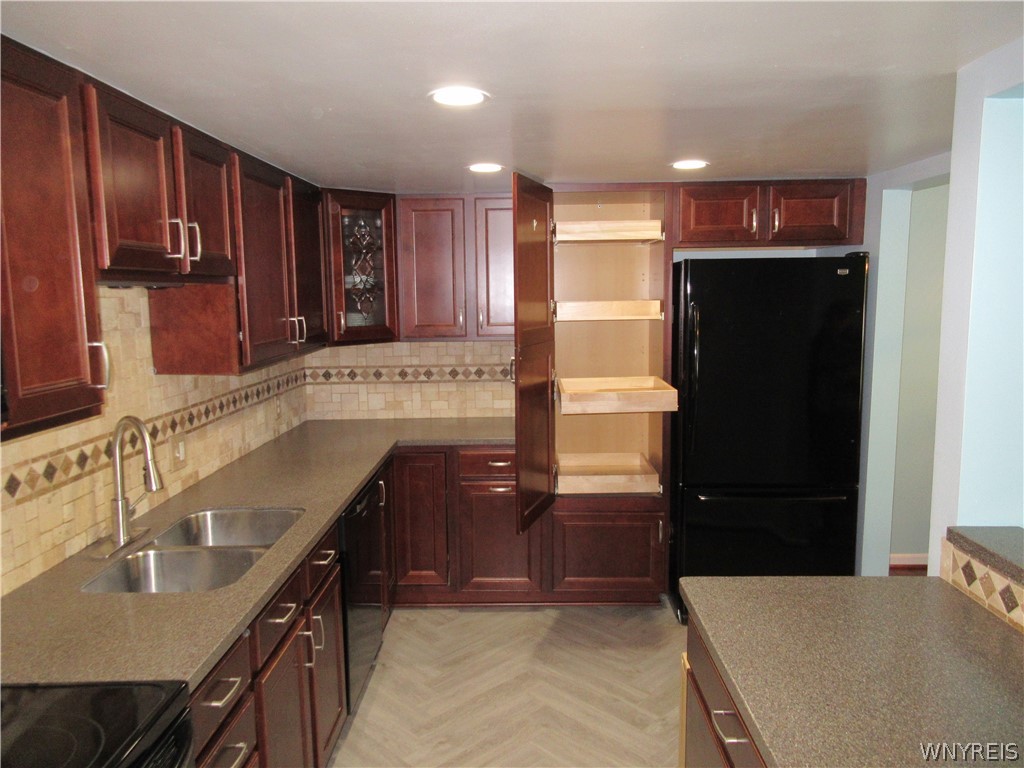 345 South Cayuga Road, Unit A Amherst, NY 14221 - Photo 5 of 24 Kitchen Pantry with pull-out drawers