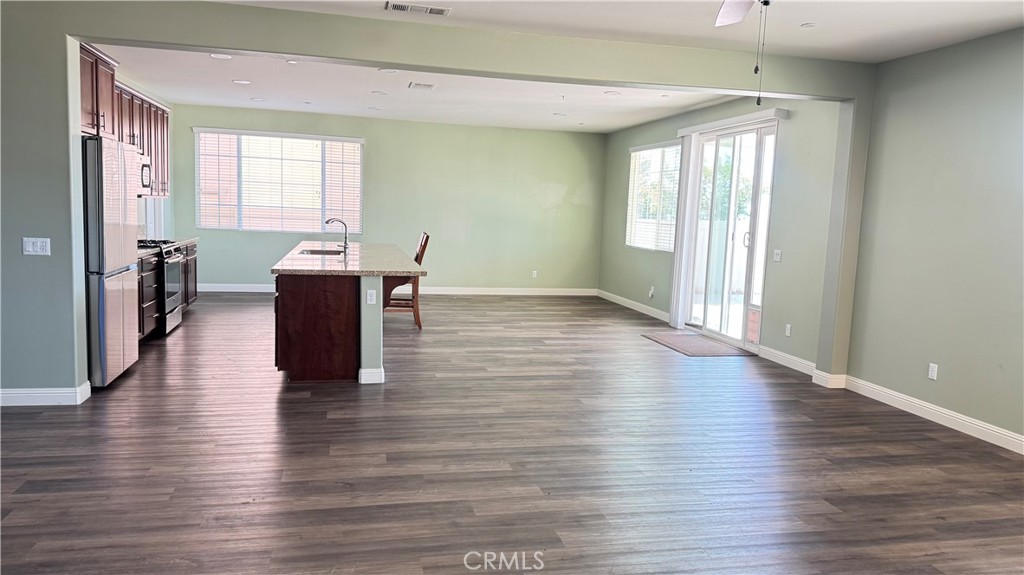 3687 White Ash Road San Bernardino, CA 92407 - Photo 12 of 29 a view of empty room with wooden floor and fan