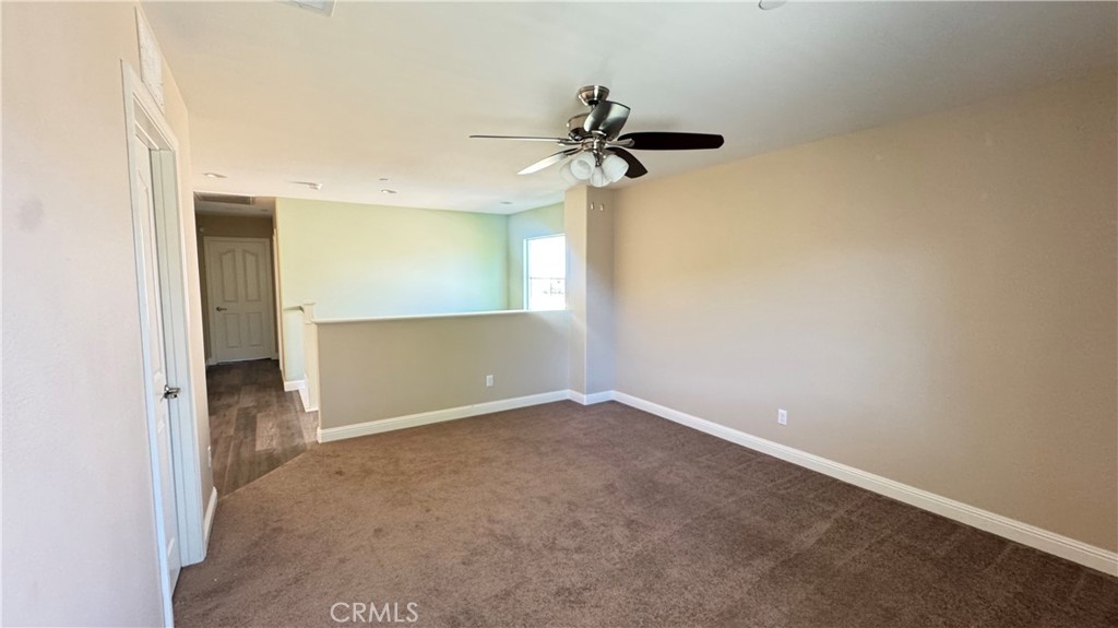 3687 White Ash Road San Bernardino, CA 92407 - Photo 18 of 29 an empty room with a empty space and a ceiling fan
