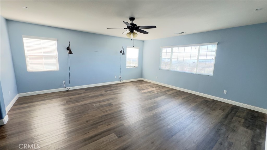 3687 White Ash Road San Bernardino, CA 92407 - Photo 19 of 29 wooden floor in an empty room with a window