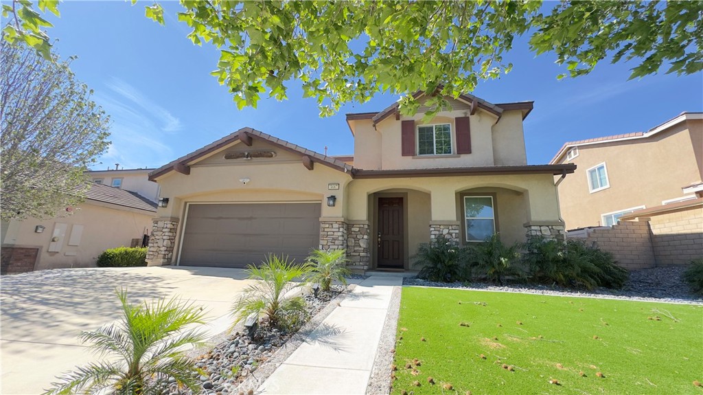 3687 White Ash Road San Bernardino, CA 92407 - Photo 2 of 29 a front view of a house with garden