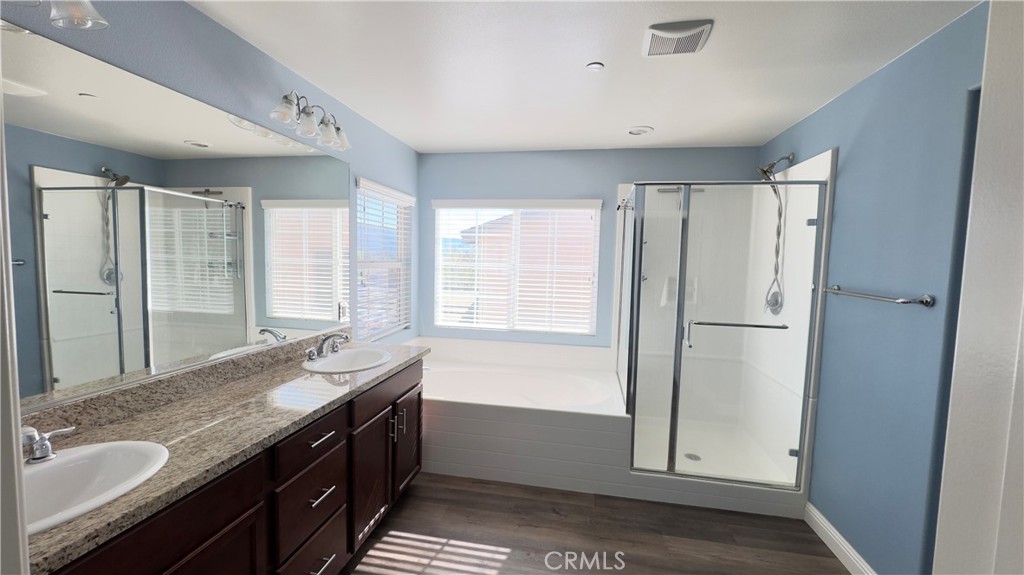 3687 White Ash Road San Bernardino, CA 92407 - Photo 21 of 29 a bathroom with double vanity and a mirror