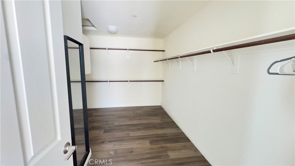 3687 White Ash Road San Bernardino, CA 92407 - Photo 23 of 29 a view of a hallway with wooden floor