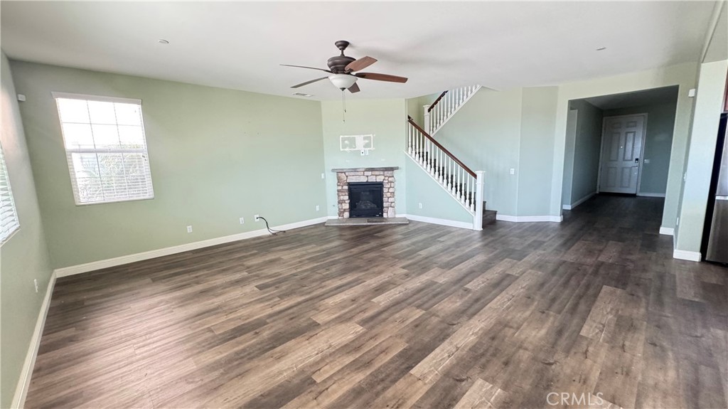 3687 White Ash Road San Bernardino, CA 92407 - Photo 5 of 29 a view of empty room with wooden floor and fan