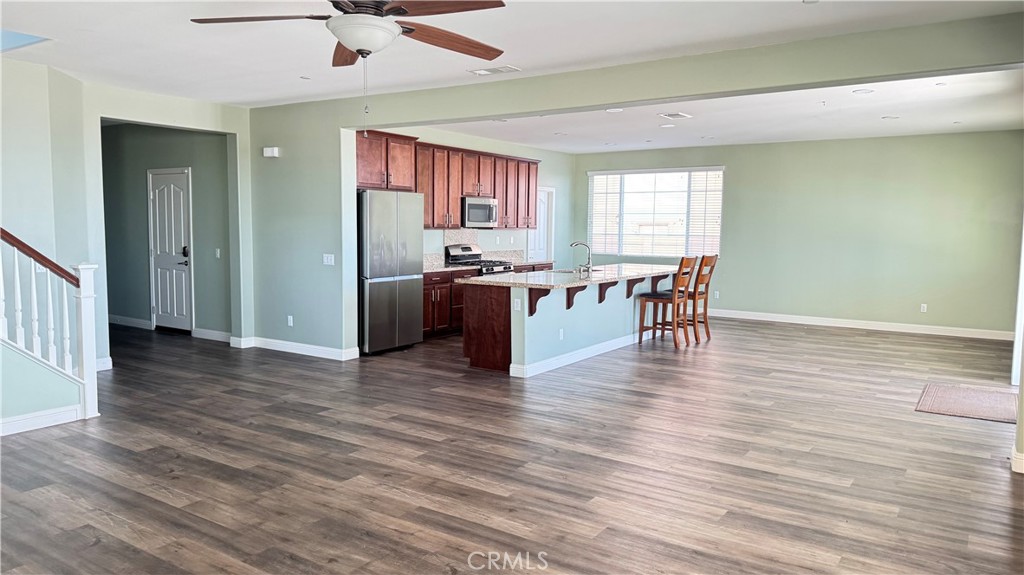 3687 White Ash Road San Bernardino, CA 92407 - Photo 7 of 29 a view of a dining room with furniture window and wooden floor
