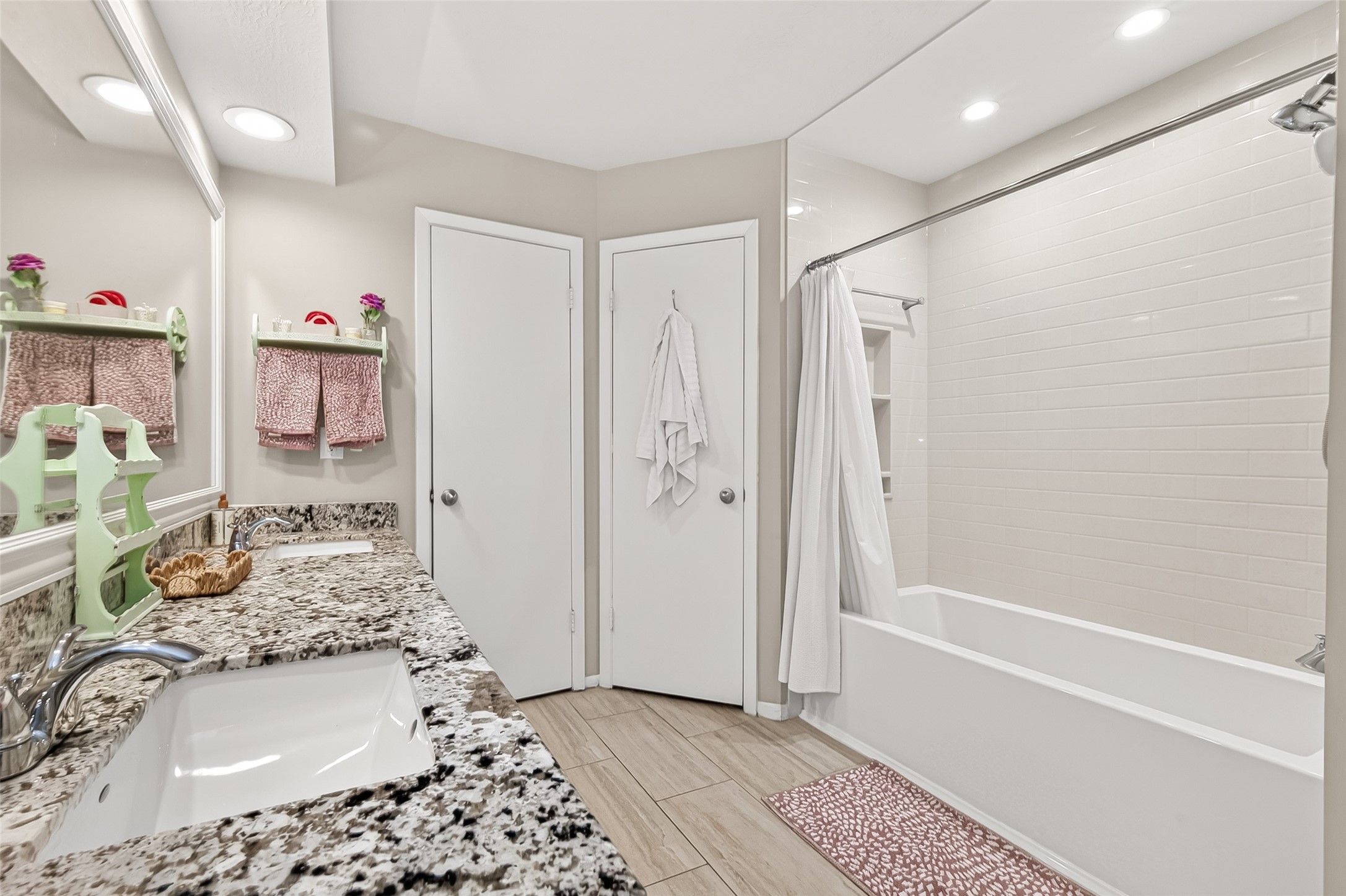 17611 Sorrell Ridge Drive Spring, TX 77388 - Photo 38 of 50 a bathroom with a tub sink and mirror
