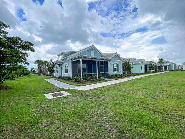 a view of house with outdoor space and garden