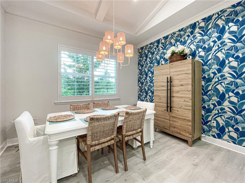 7162 Saona Court Naples, FL 34113 - Photo 8 of 19 a dining room with furniture and window