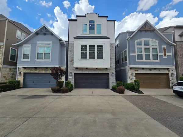 a front view of a house with yard