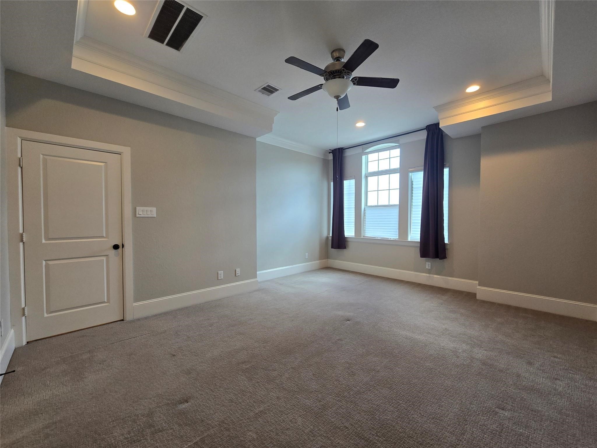 11918 Stirling Row Lane Houston, TX 77082 - Photo 13 of 21 an empty room with ceiling fan and windows