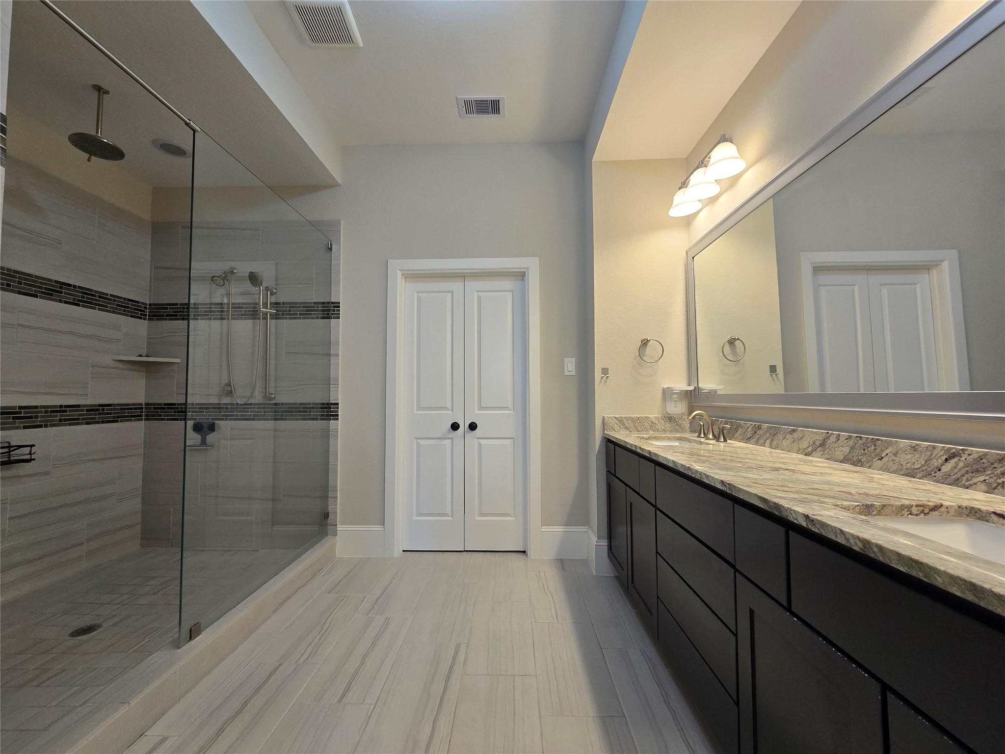 11918 Stirling Row Lane Houston, TX 77082 - Photo 15 of 21 a bathroom with a granite countertop sink mirror and double