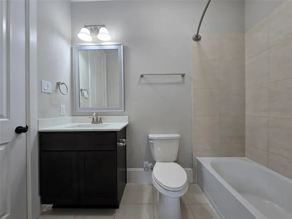 a bathroom with a sink a toilet and bathtub