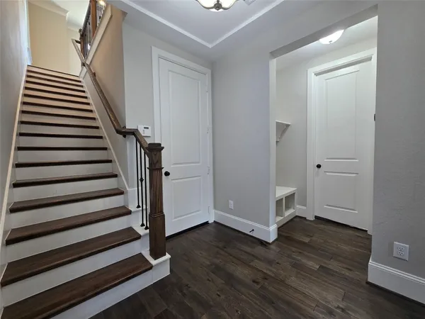 a view of entryway with wooden floor