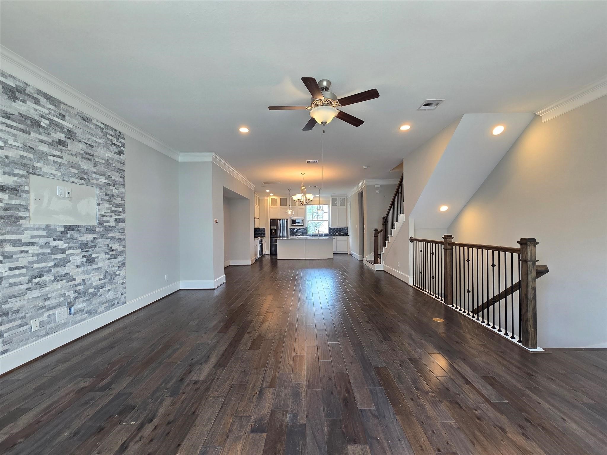 11918 Stirling Row Lane Houston, TX 77082 - Photo 9 of 21 a view of a livingroom with wooden floor and a ceiling fan