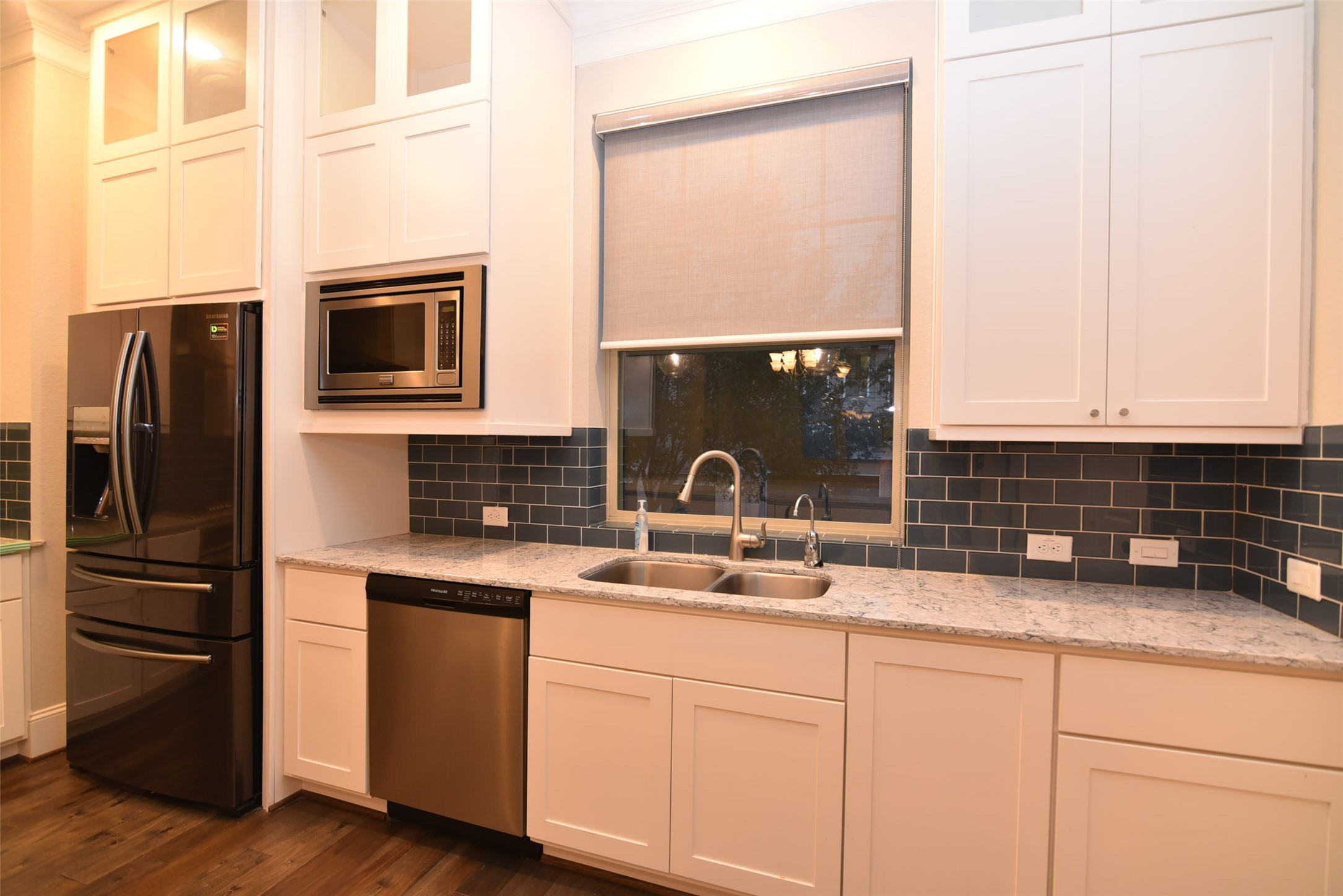 11918 Stirling Row Lane Houston, TX 77082 - Photo 10 of 21 a kitchen with stainless steel appliances white cabinets and a granite counter tops