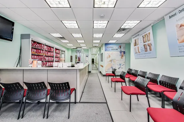 a living room with furniture a rug and a wall painting