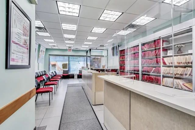 a kitchen with stainless steel appliances kitchen island granite countertop a sink and cabinets