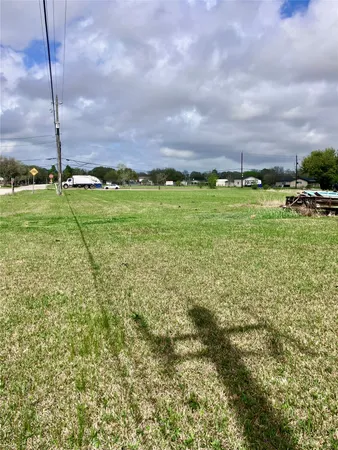 a view of a field with an ocean