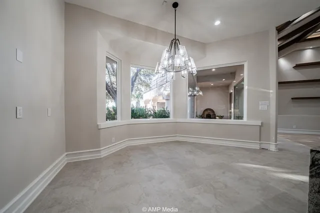 a kitchen with stainless steel appliances granite countertop a sink a counter space stainless steel appliances cabinets and a counter top space