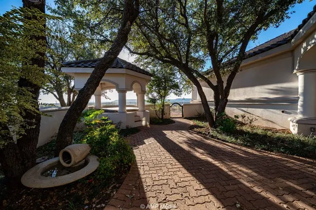 a bathroom with a bathtub a shower and a mirror