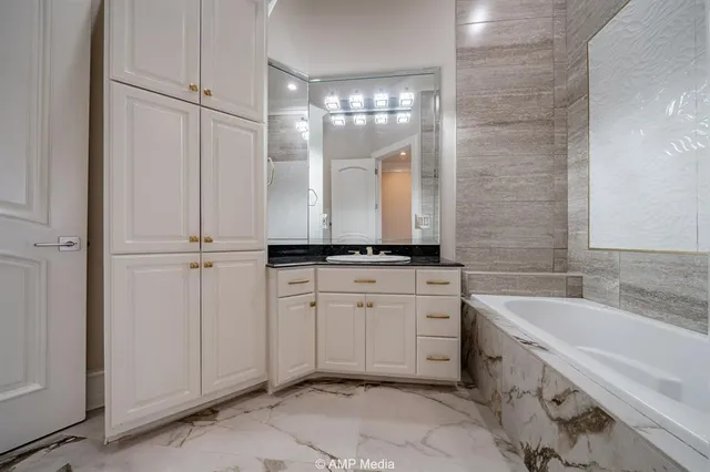wooden floor in an empty room with a kitchen