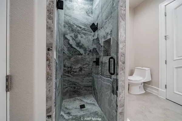 a kitchen with a sink dishwasher stove and cabinets