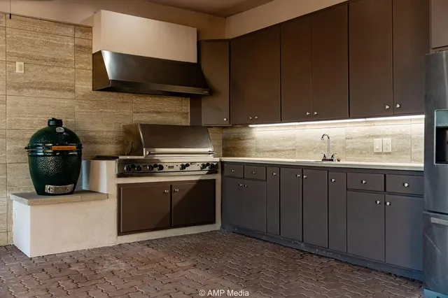a view of a house with backyard water and sitting area