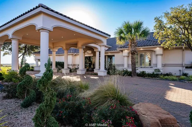 a front view of house with yard and green space