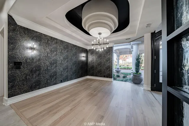 a large kitchen with a table and chairs
