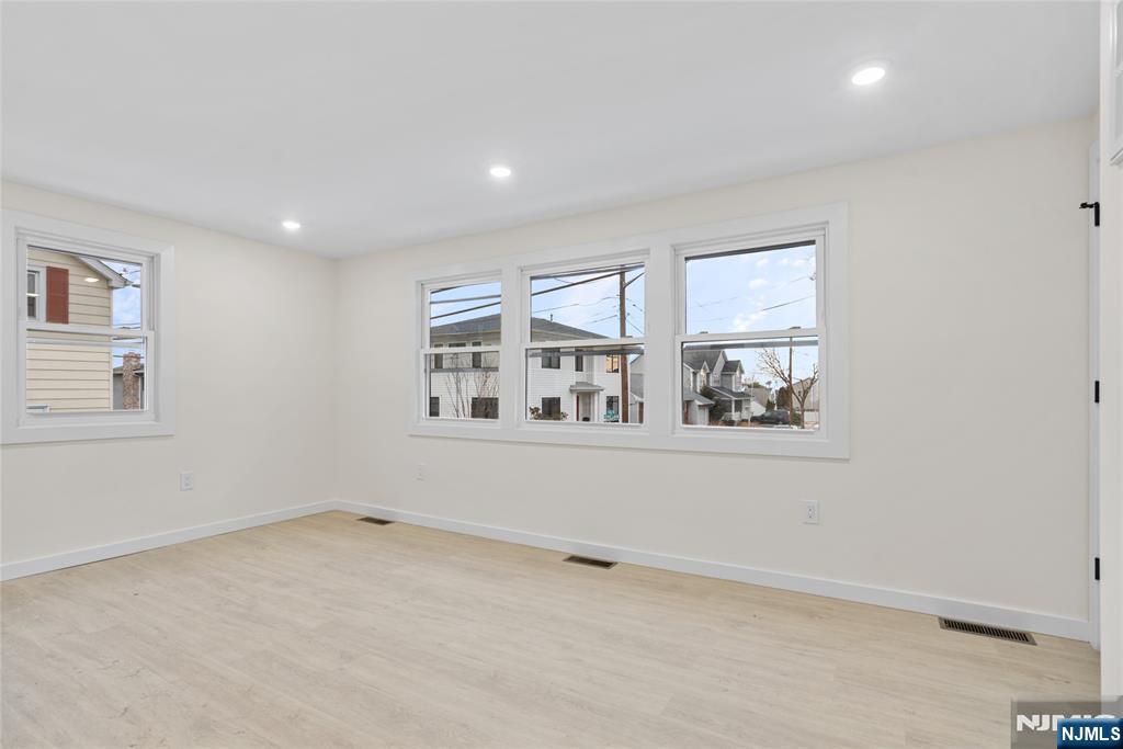 369 Hops Lane Secaucus, NJ 07094 - Photo 9 of 17 an empty room with windows