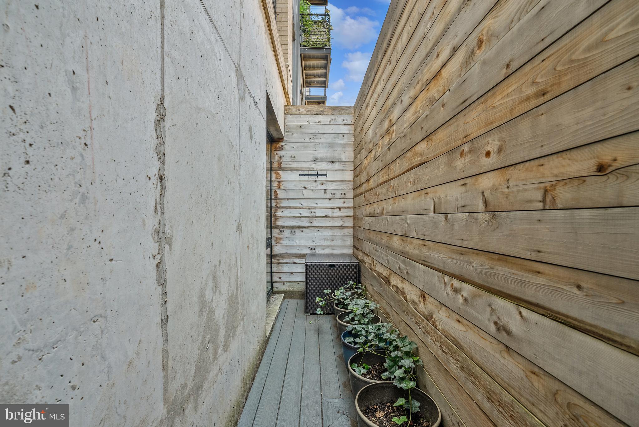 1016 17th Place Northeast, Unit 7 Washington, DC 20002 - Photo 18 of 28 a view of a pathway with a wall