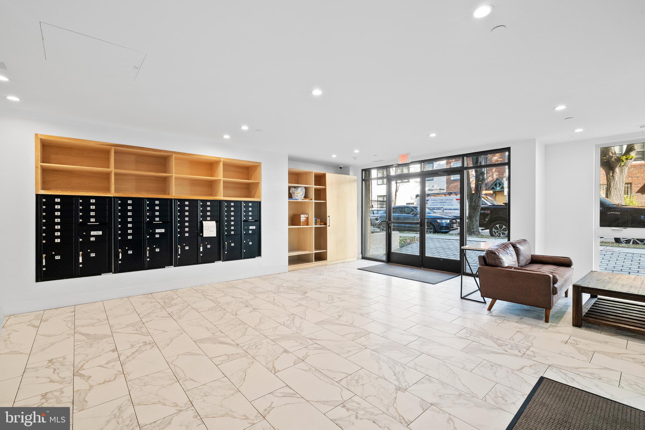 1016 17th Place Northeast, Unit 7 Washington, DC 20002 - Photo 19 of 28 a large room with windows and furniture