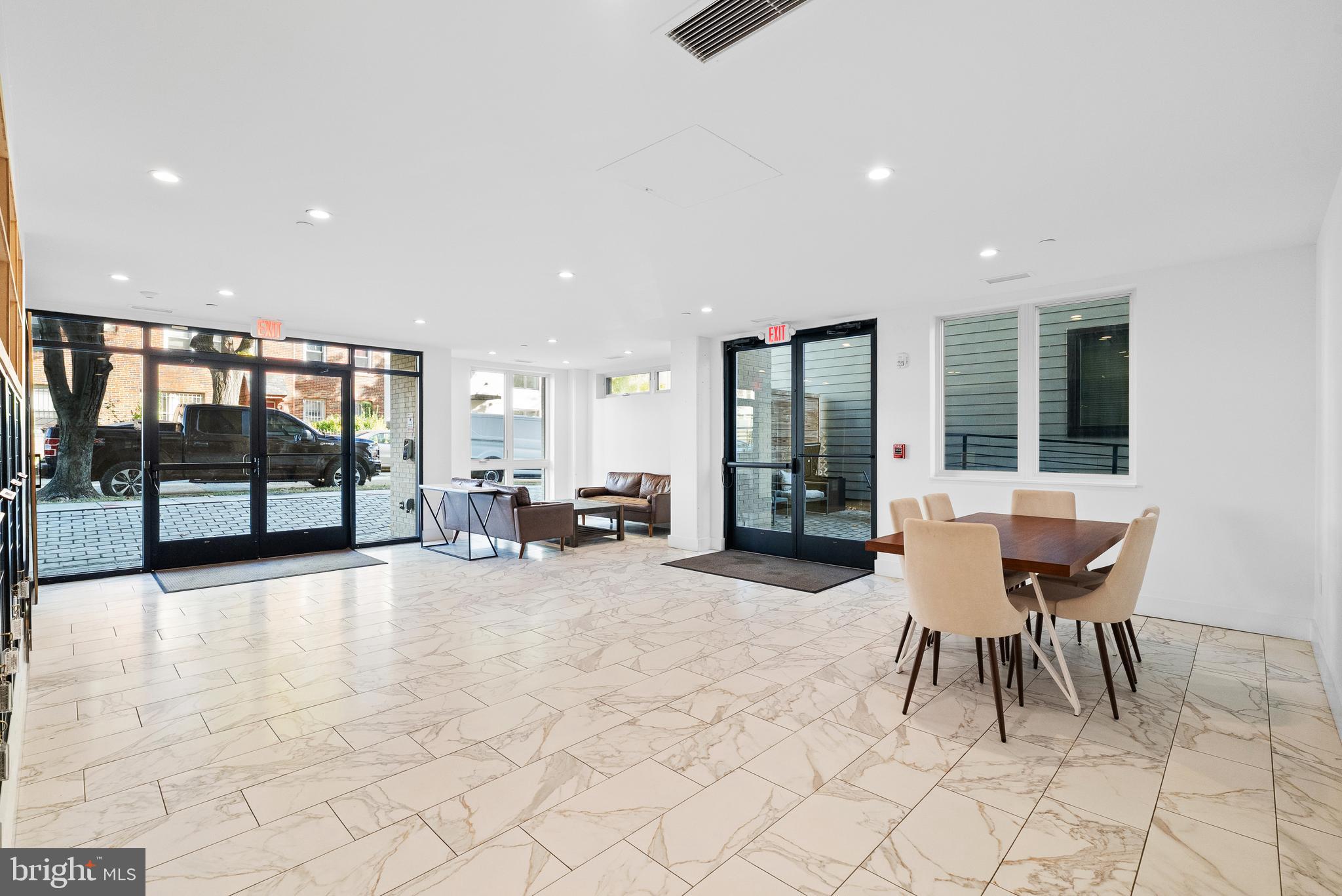 1016 17th Place Northeast, Unit 7 Washington, DC 20002 - Photo 20 of 28 a view of a lobby with furniture and floor to ceiling window