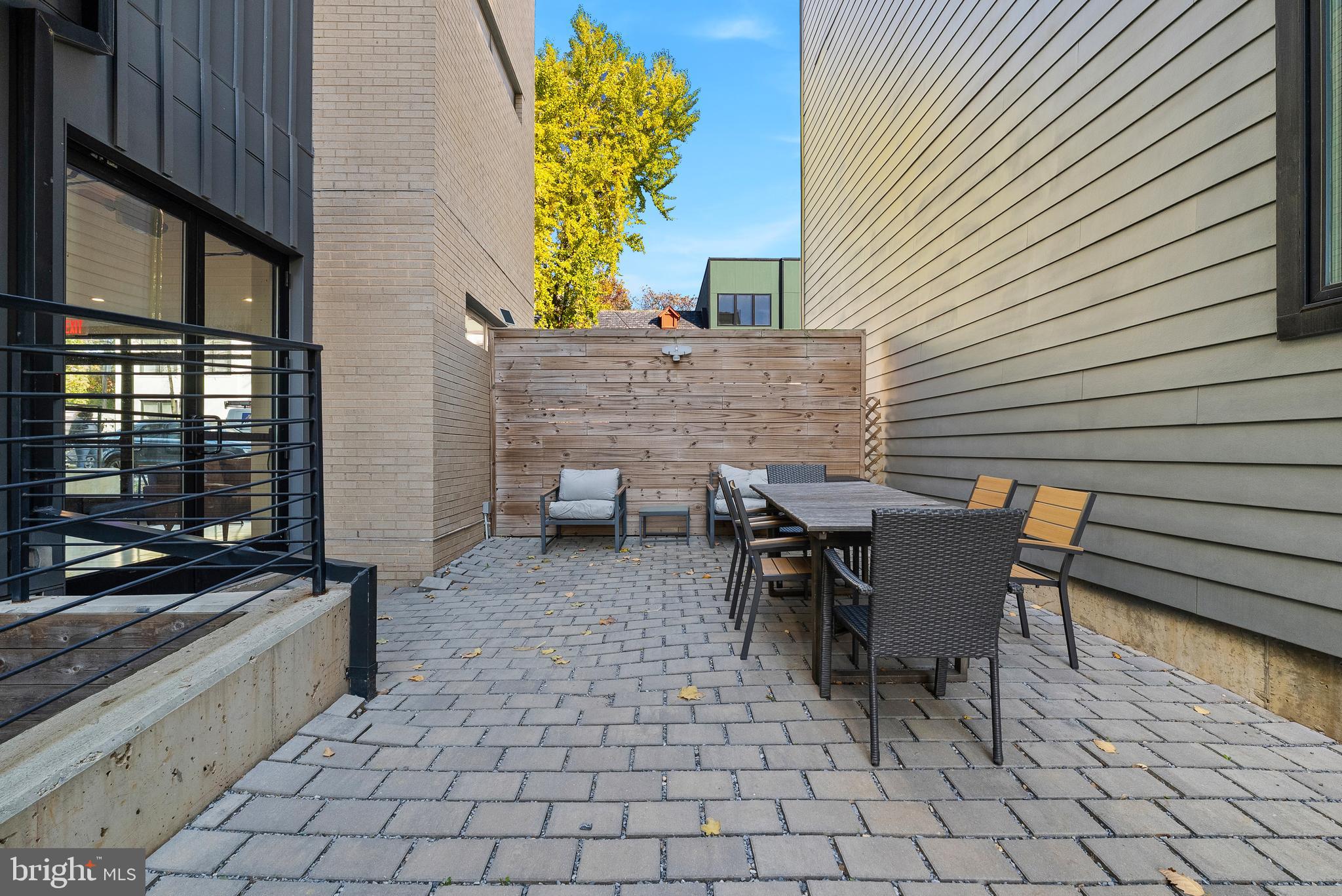 1016 17th Place Northeast, Unit 7 Washington, DC 20002 - Photo 22 of 28 a patio with table and chairs