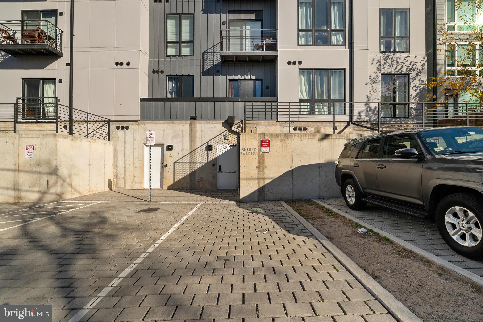 1016 17th Place Northeast, Unit 7 Washington, DC 20002 - Photo 26 of 28 a view of a car park in front of a building