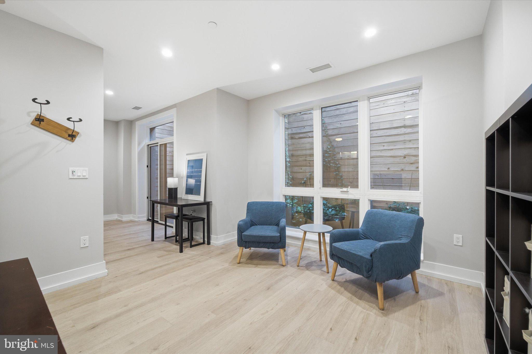 1016 17th Place Northeast, Unit 7 Washington, DC 20002 - Photo 4 of 28 a living room with furniture and a window