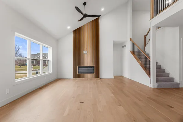 an empty room with a empty space and windows