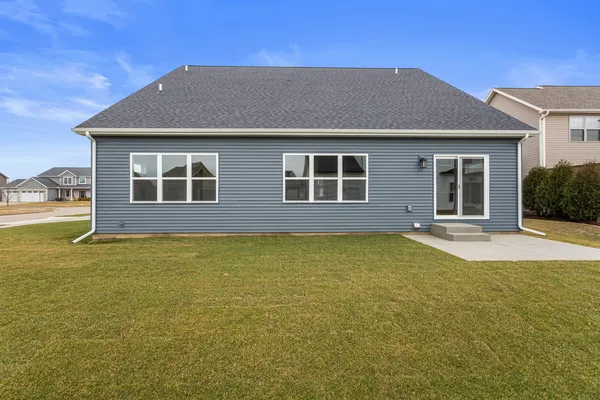 a kitchen with stainless steel appliances granite countertop white cabinets and sink