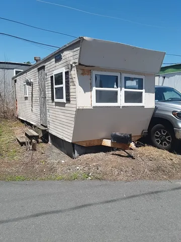 a house view with a backyard space