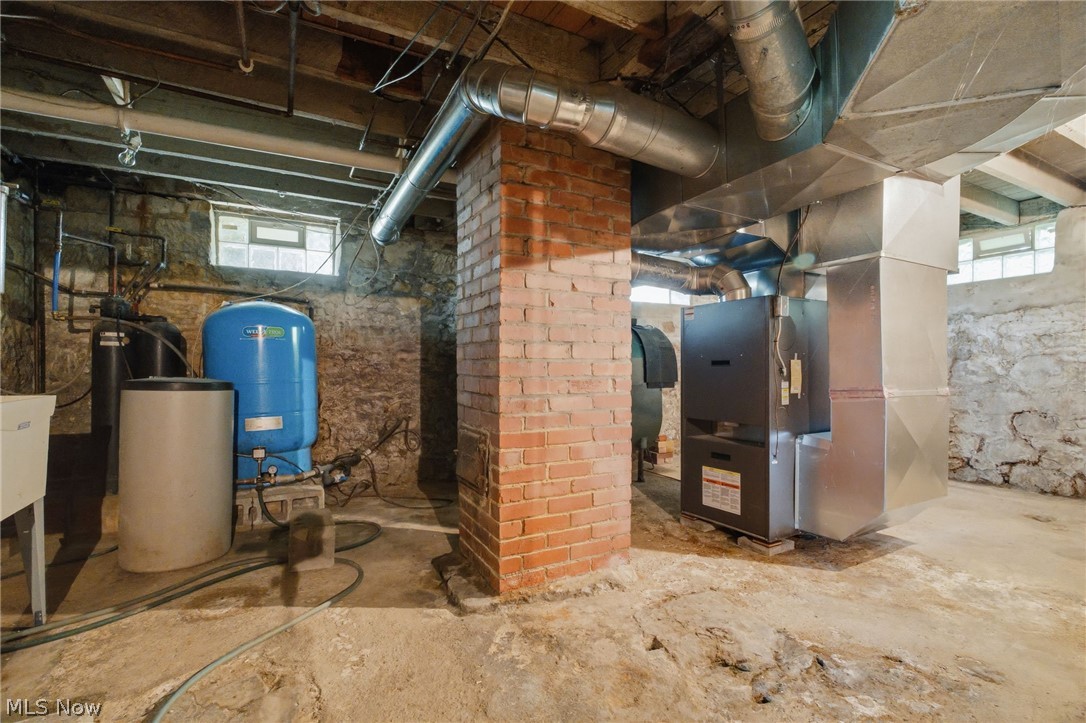 11513 Kile Road Chardon, OH 44024 - Photo 22 of 48 Basement showing furnace, chimney and well pump