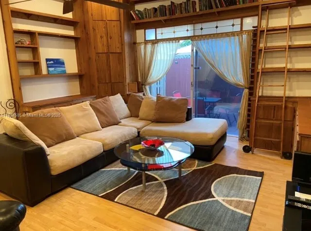 a living room with furniture and a rug