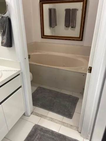 a dinning room with furniture and a window