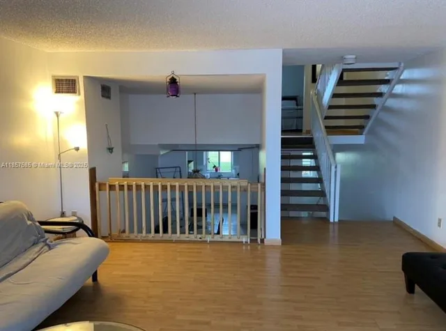 a bedroom with a large bed and a tv